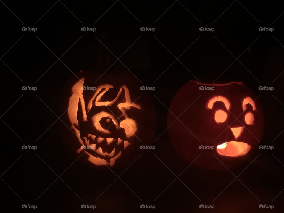 Stitch from Lilo and stitch and traditional face jack o lanterns at night for Halloween 