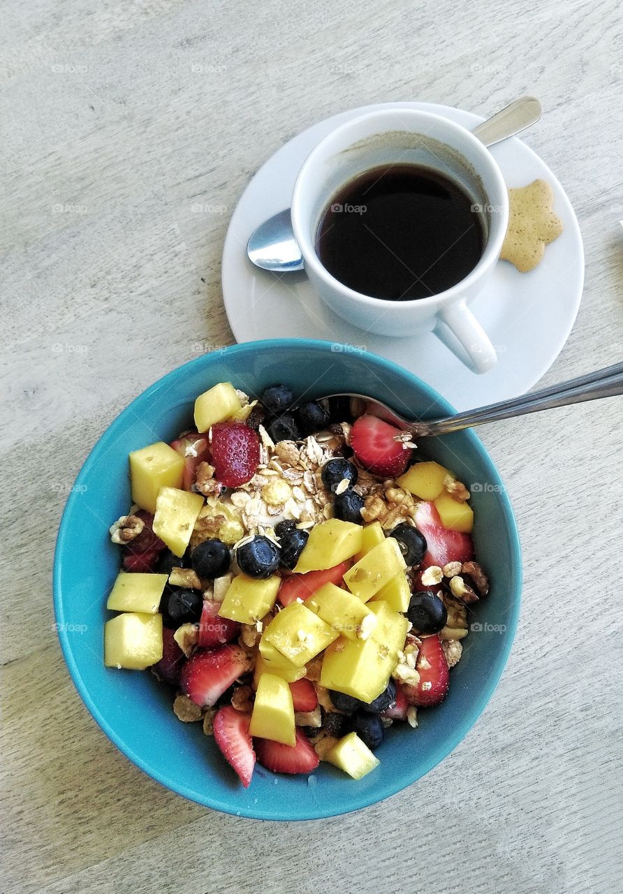 Coffee and Healthy Granola with fresh fruits