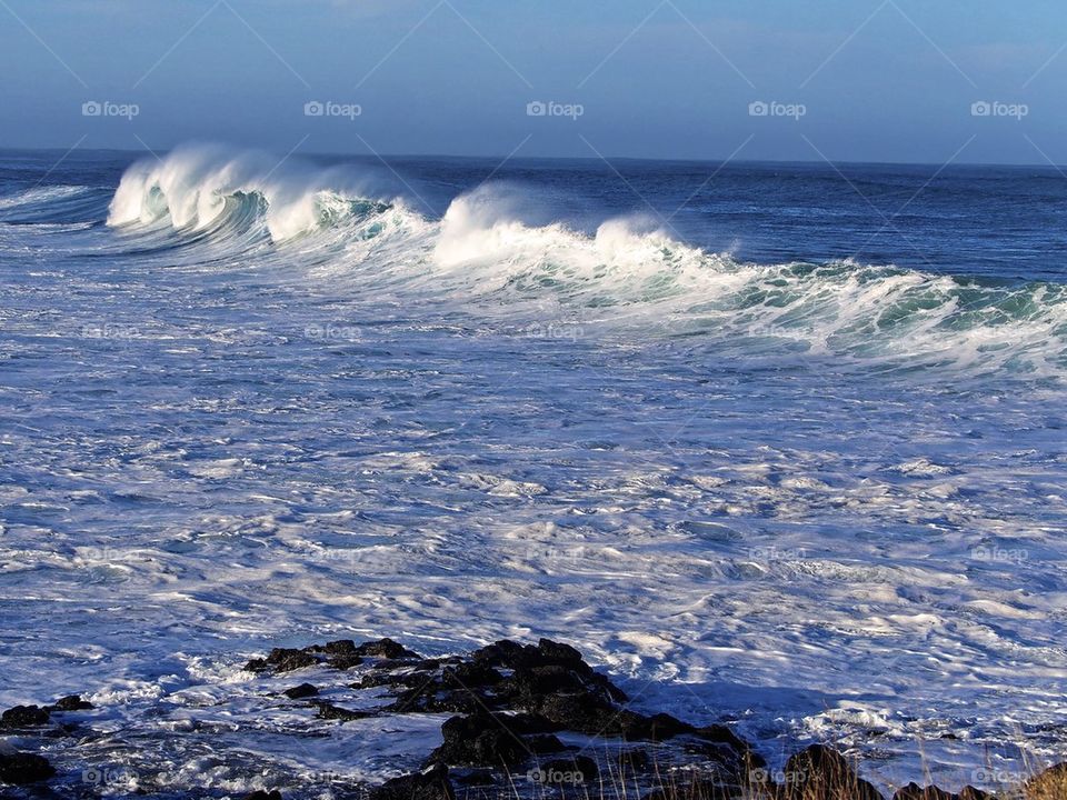 Scenic view of splashing wave