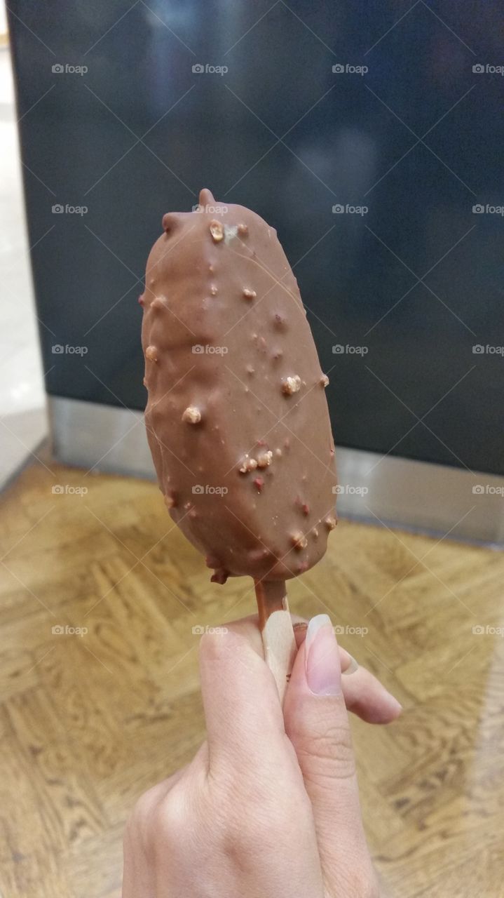 One hand, one ice-cream.