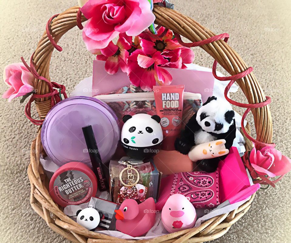 Gift basket full of fun pink products.