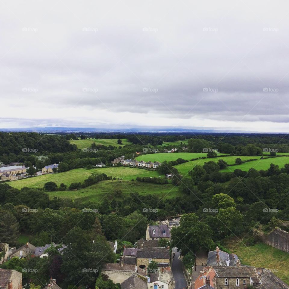 View over a North Yorkshire town and green fields with a grey sky 