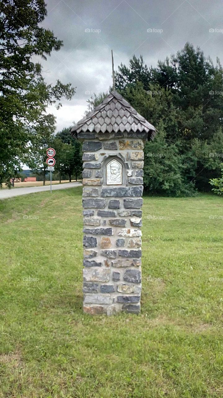small monument on the side of a road
