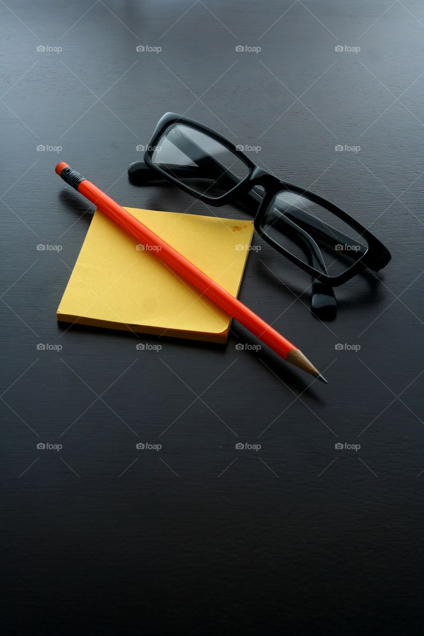 pencil, notepad and eyeglasses. photo of pencil, notepad and eyeglasses