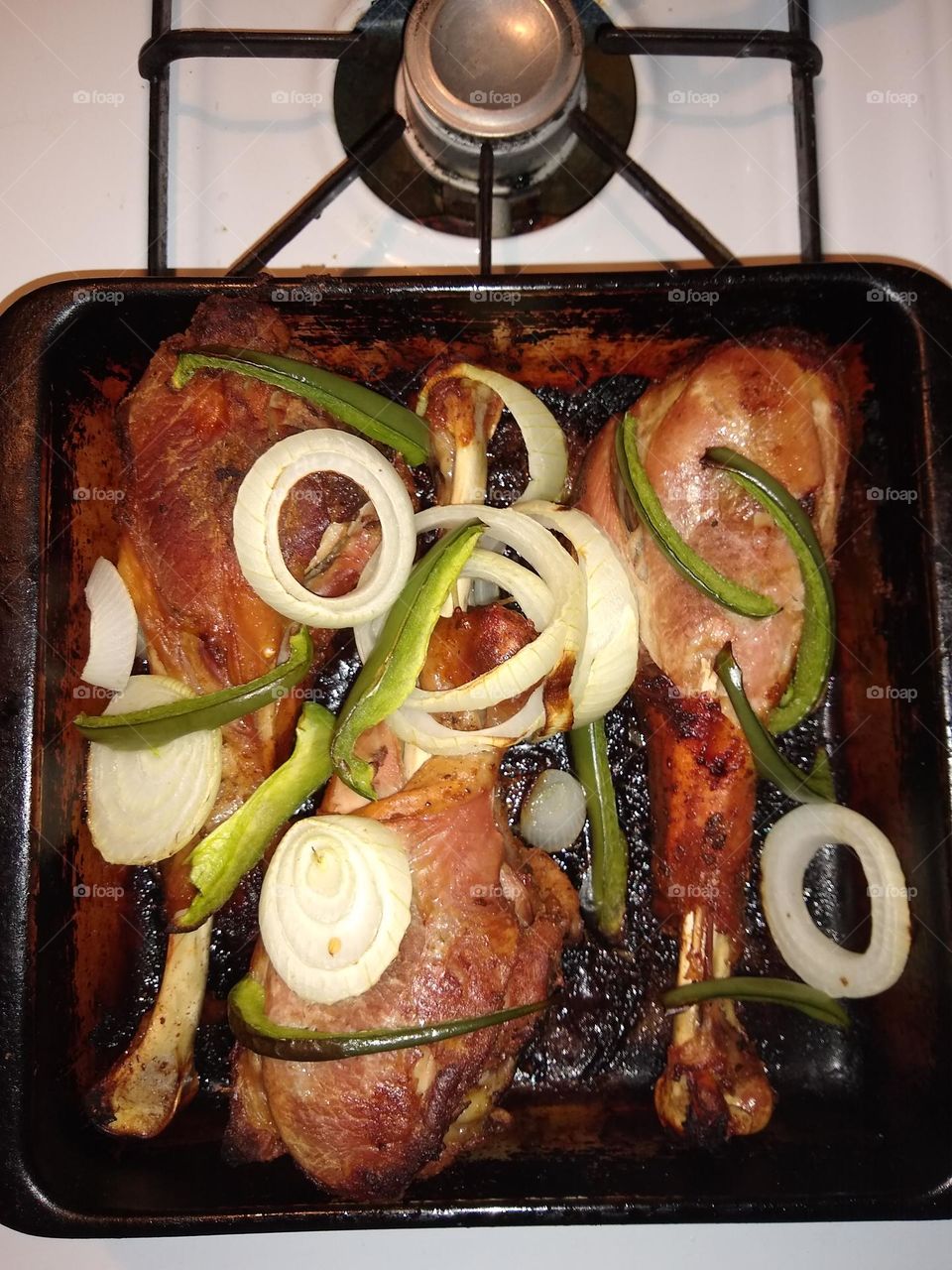 Turkey 🦃 legs with onions and bell peppers.