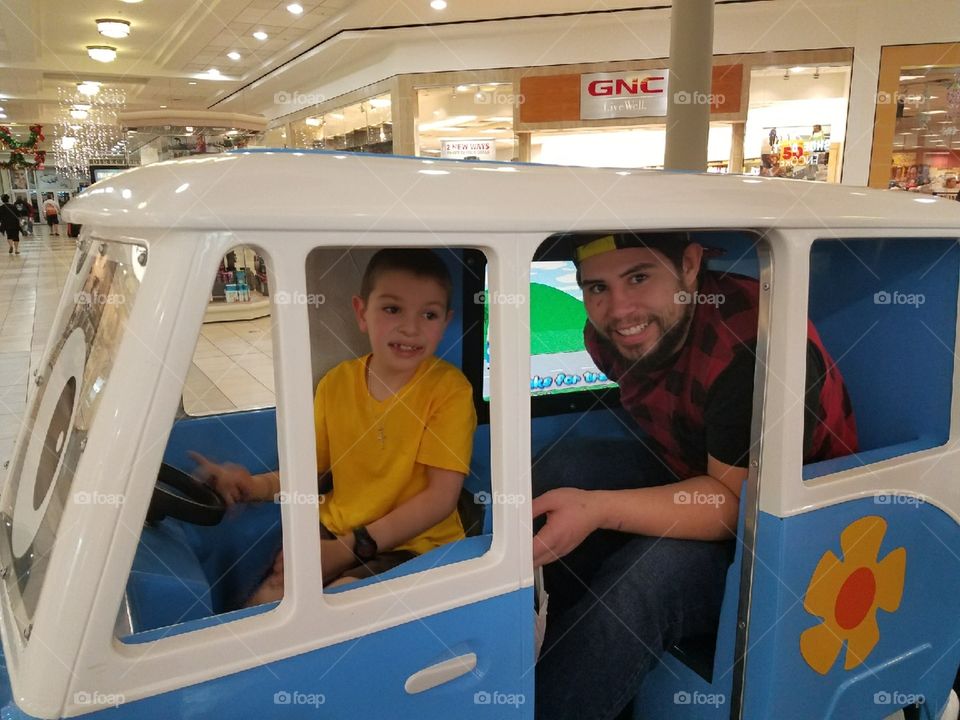 My to baby boys in a machine car how they both fit idk lol.