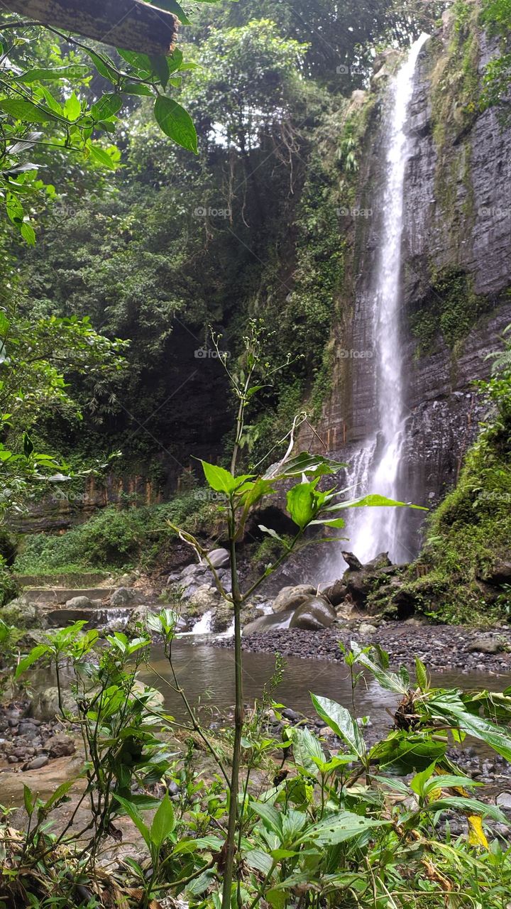 Waterfalls and large rocks at the Batu Mahpar tourist spot, Tasikmalaya Regency, West Java, Indonesia, on Wednesday 8 December 2021.