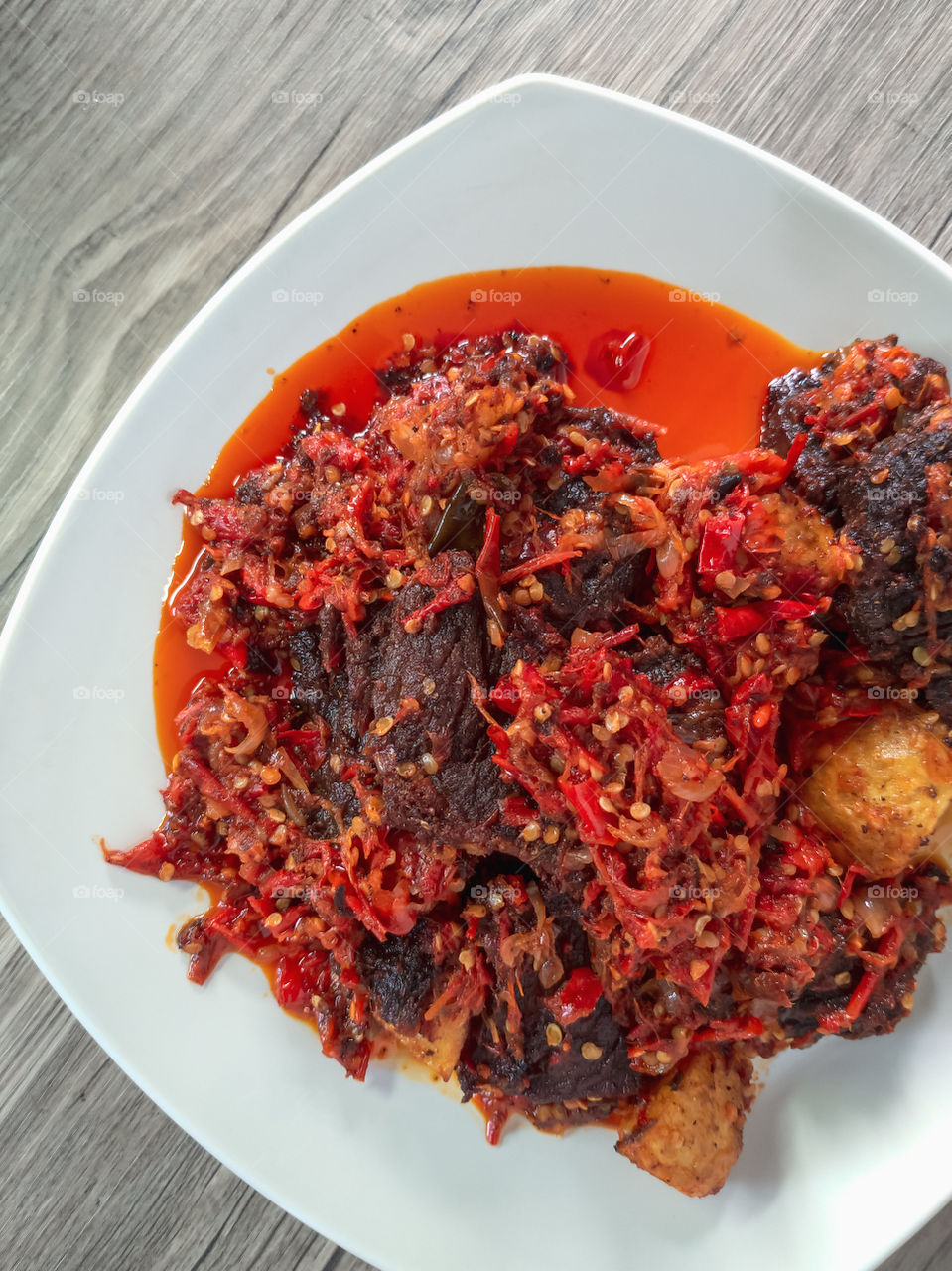 Dendeng Balado or jerky beef is a delicious food that comes from Padang  West Sumatra. Balado beef jerky is fried beef and given a spicy sauce