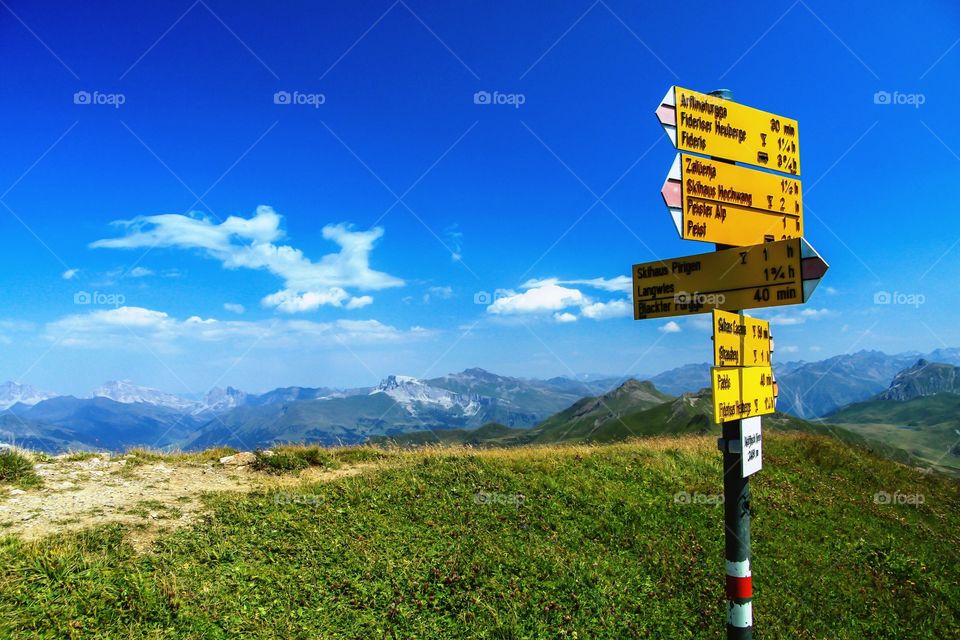 hiking signpost on the swiss mountains with a beautiful panorama