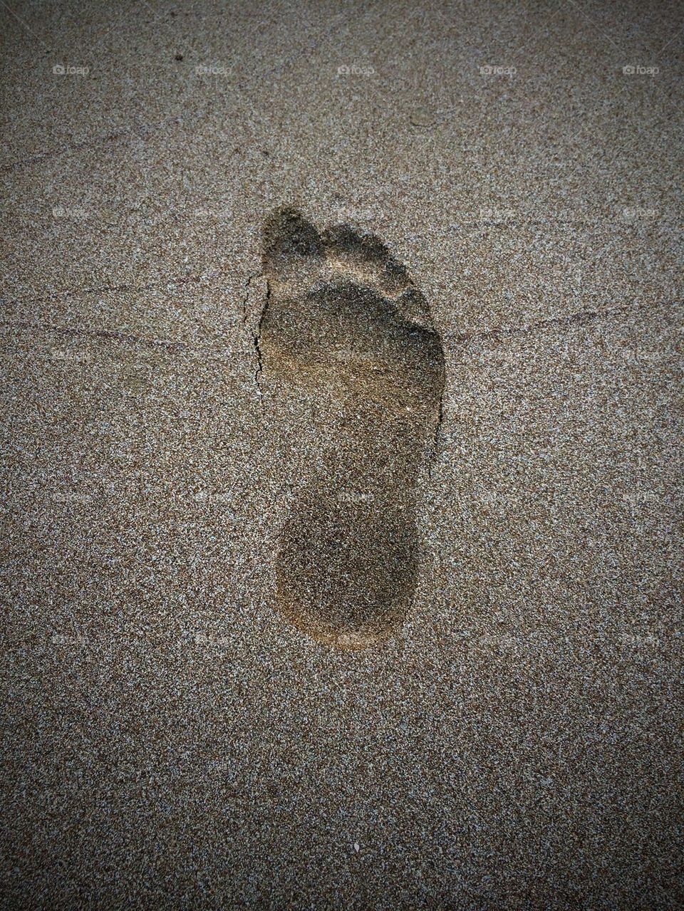 Footprint in sand