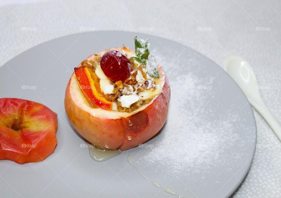 Baked apple stuffed with cheese and walnuts