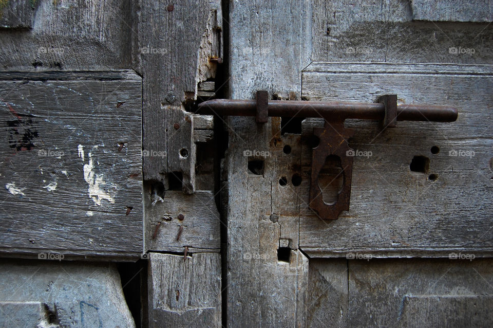 Old and worn Door locked in Stonetown on Zanzibar.