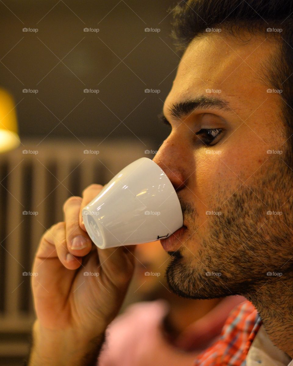 Close-up of a man drinking coffee