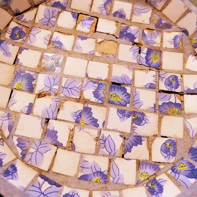 Beautiful tile. Purple flowers on the tile.
