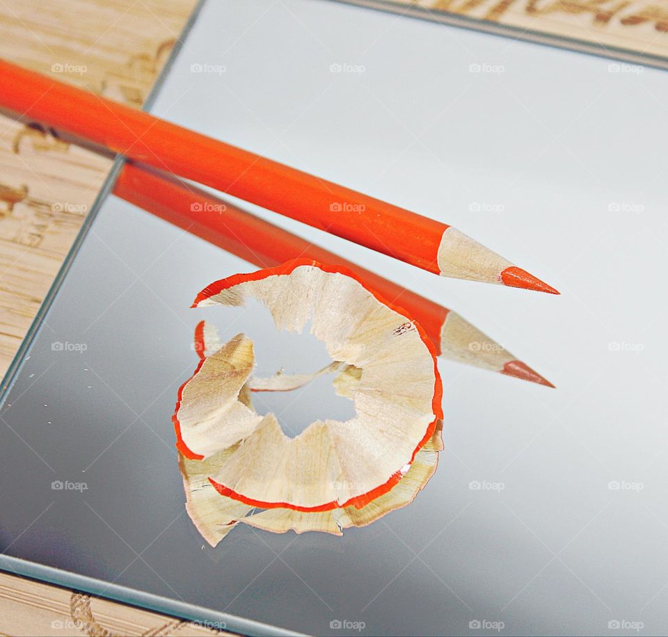 reflections of a wooden Orange pencil