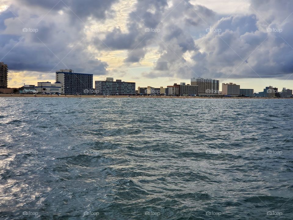 Across the cloudy bay.  A breathtaking view of the skyline on a to cloudy day.