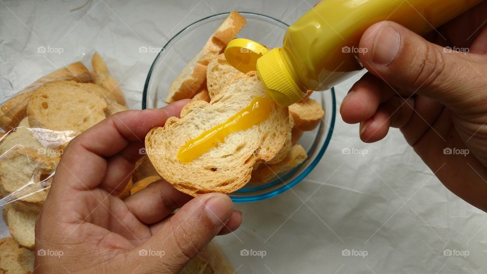 Close-up of human's hand preparing food