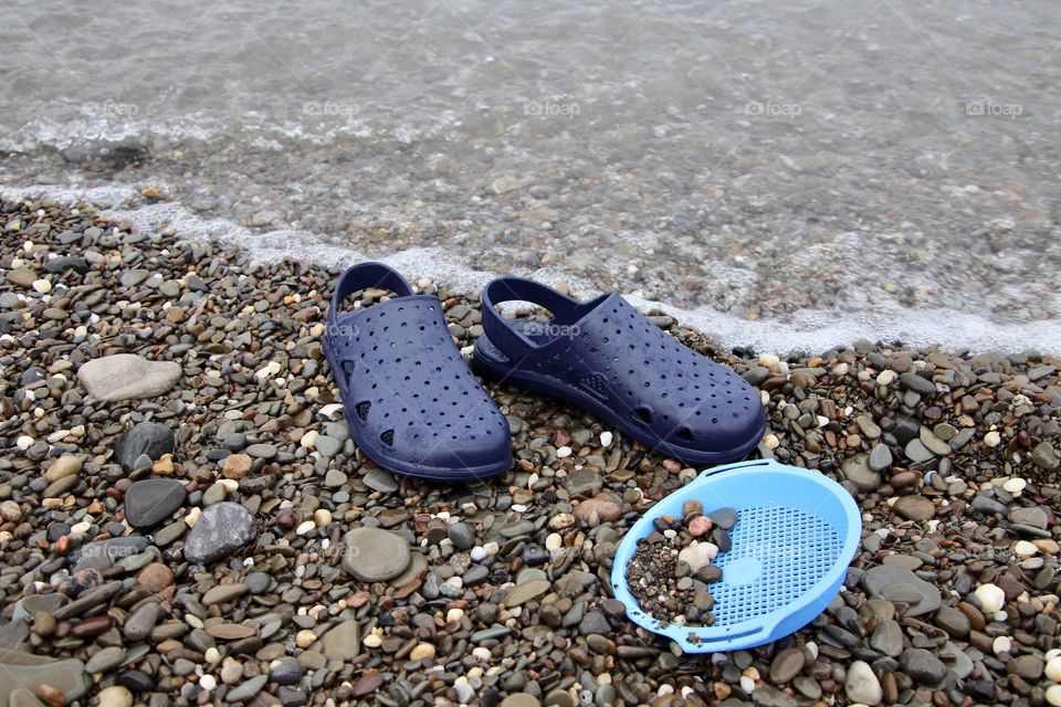 Totes sandals at beach