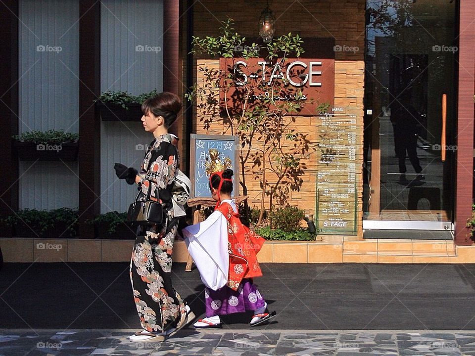 Japanese mom and kid walking