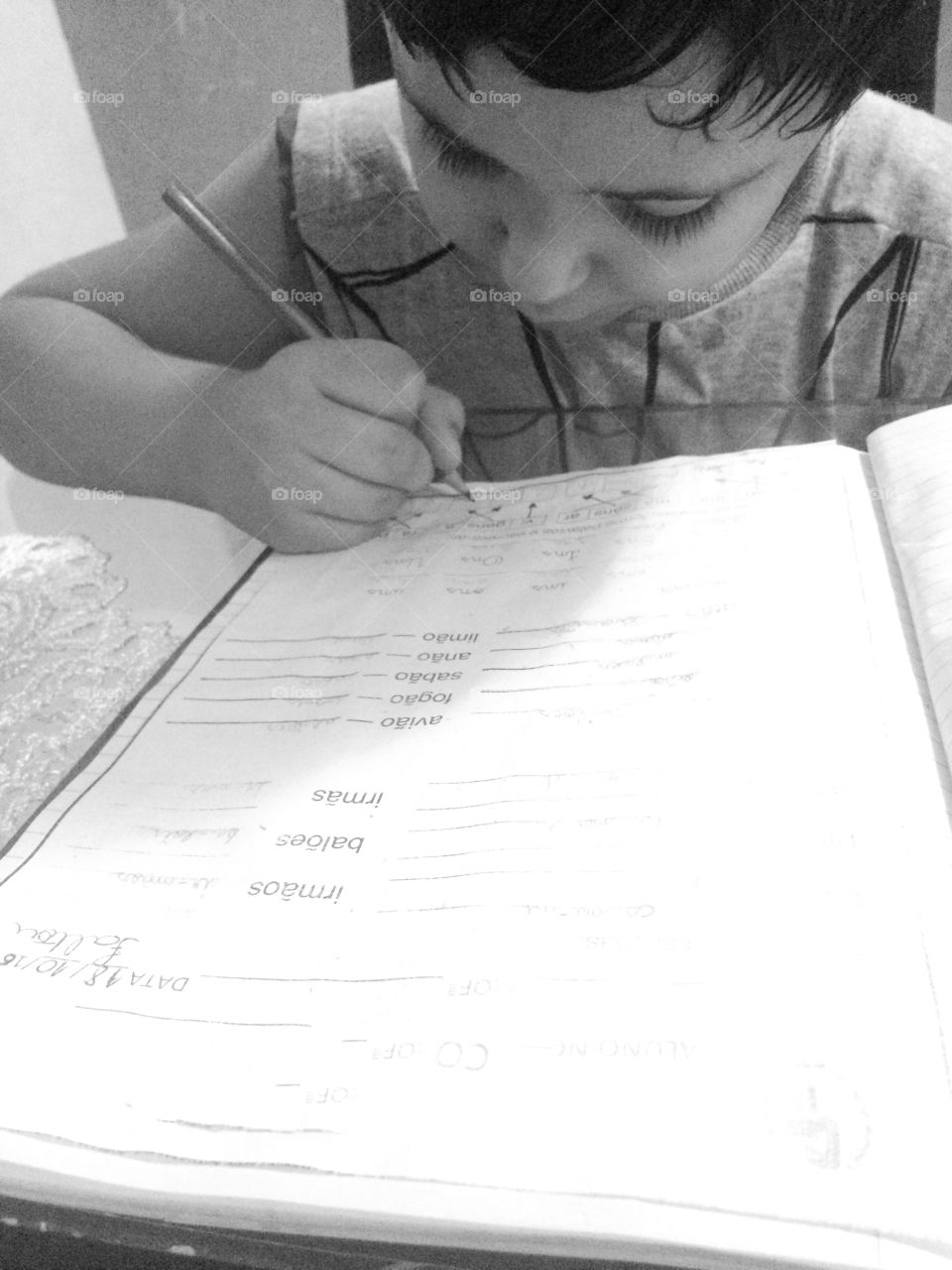 A little boy doing his homework at home