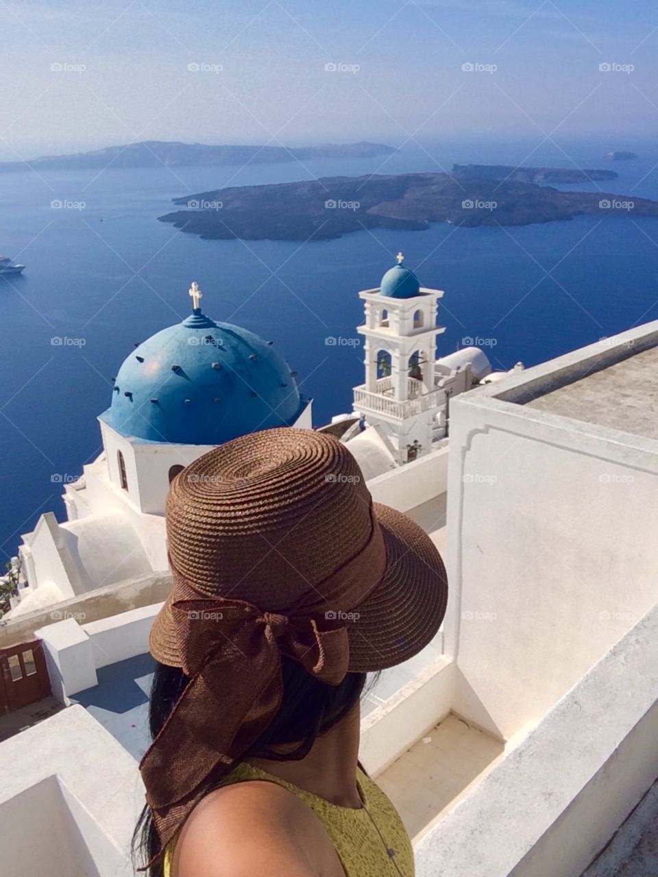 Santorini lover. Selfie with famous landmark of Santorini, Blue dome of church, summertime, Greece, Mediterranean sea, Europe 