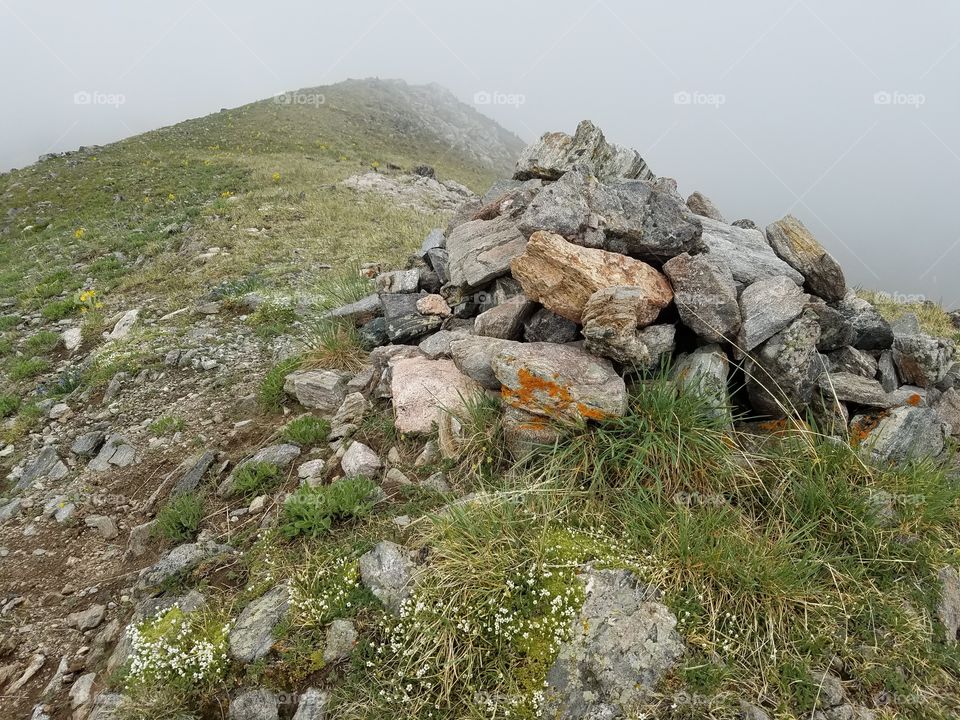 A cairn at the topnof Ptarmigan Peak in Byers Wilderness Colorado