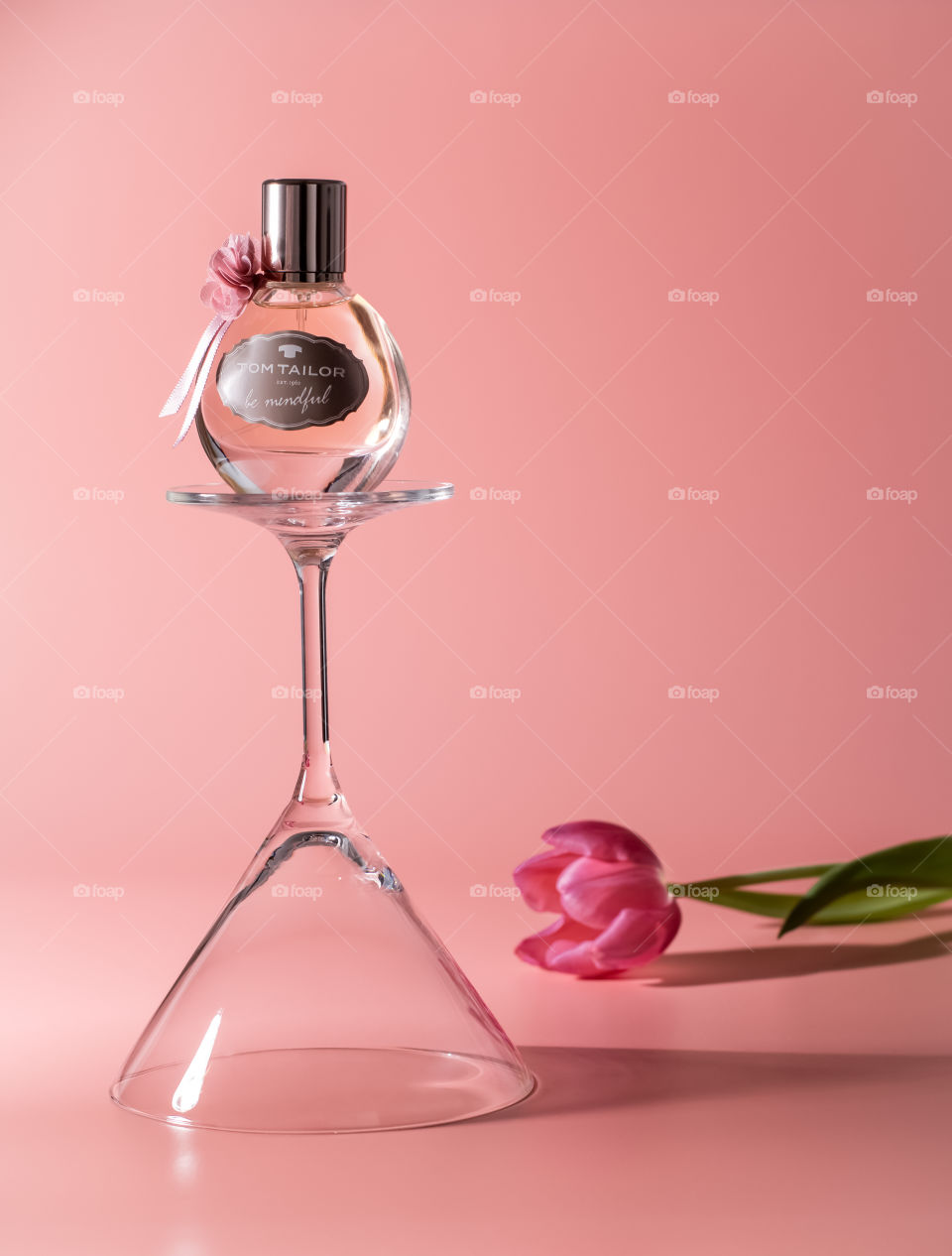 Parfum with a flower , rose background 
