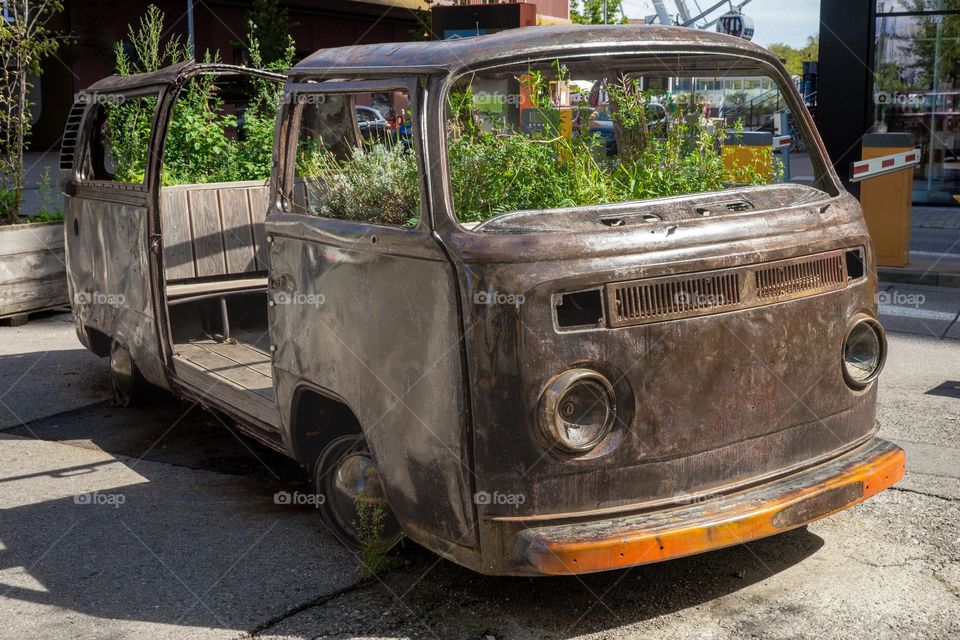 old VW bus with plants