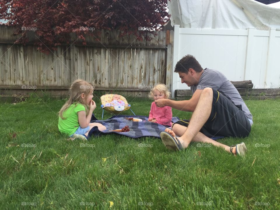 Father having a picnic with his children