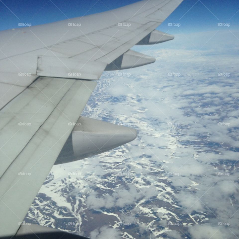 Flying Over Siberia . I flew over the snowy mountains of Siberia on my way to China! Enjoy!  