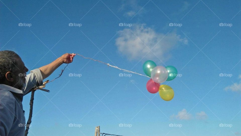 Beautiful and multicolor balloons embraced blue high sky at essaouira city in Morocco.