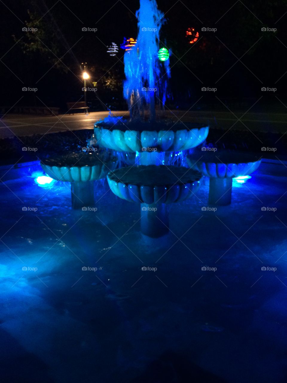 A beautiful fountain illuminated blue in on of Turkey's delightful parks. 