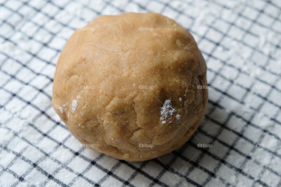 Close up of ready dough for American peanut butter cookies  on the checkered napkin