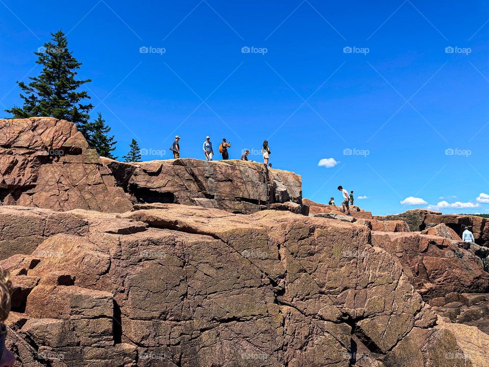 “Cliff Top Tourists.”  Visitors flock to the edges of the granite shores of Acadia National Park.