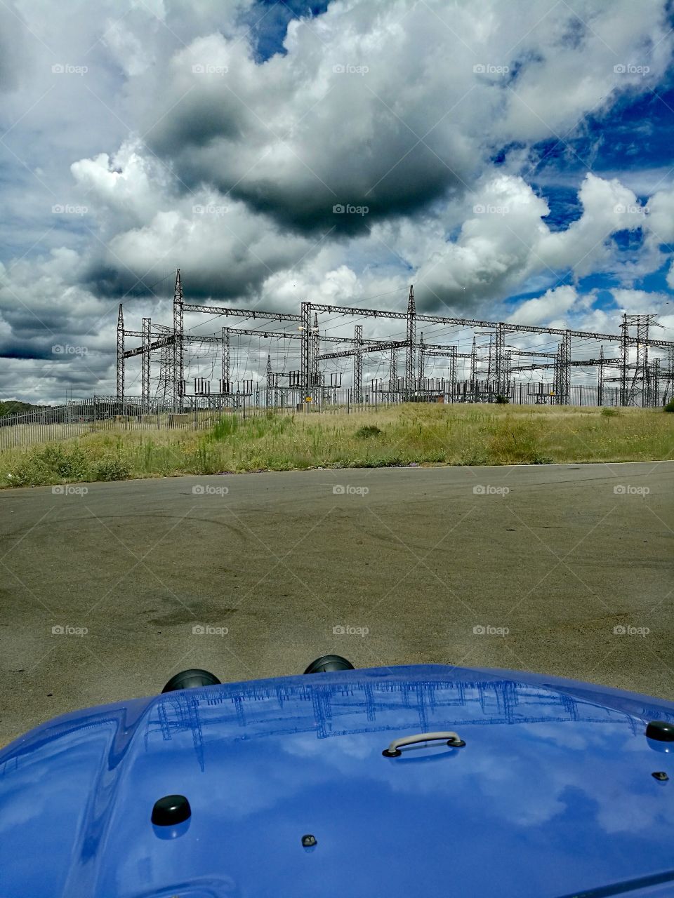 Electrical power station with rain clouds.