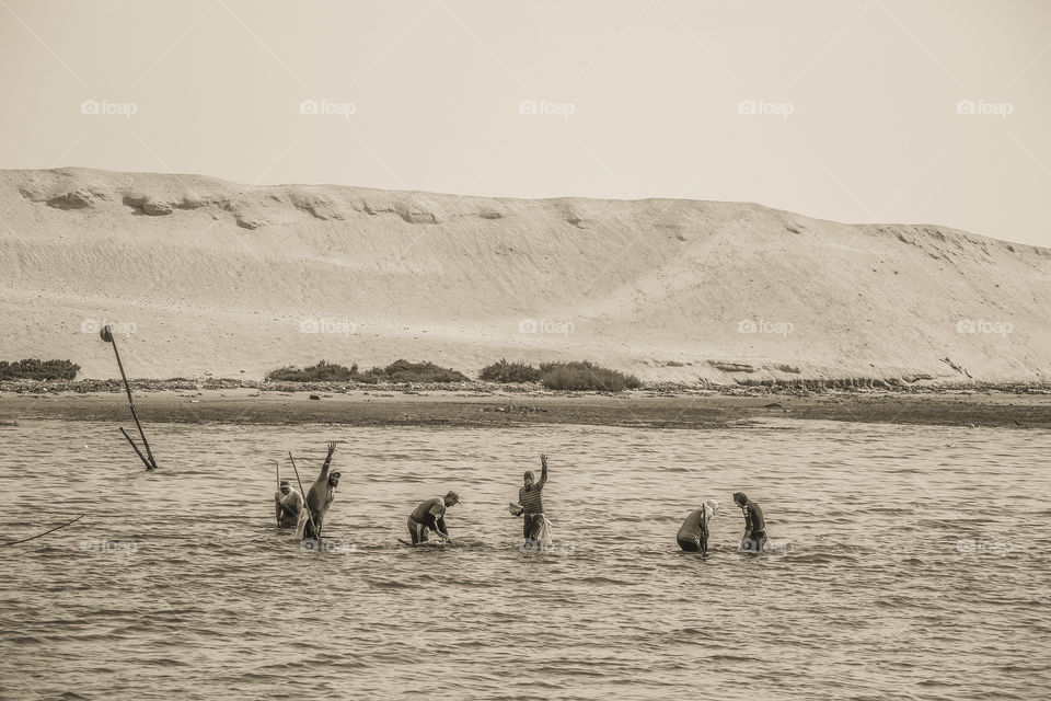 People fishing in Suez Canal, Egypt