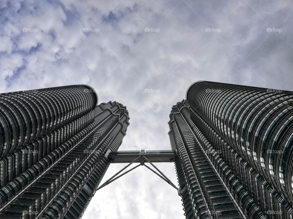 Petronas twin towers in Kuala Lumpur, Malaysia photographed from below
