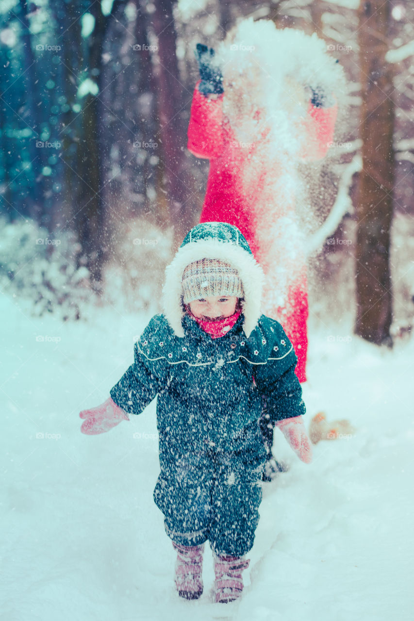 Winter with friends. Spending wintertime outdoors playing with snow