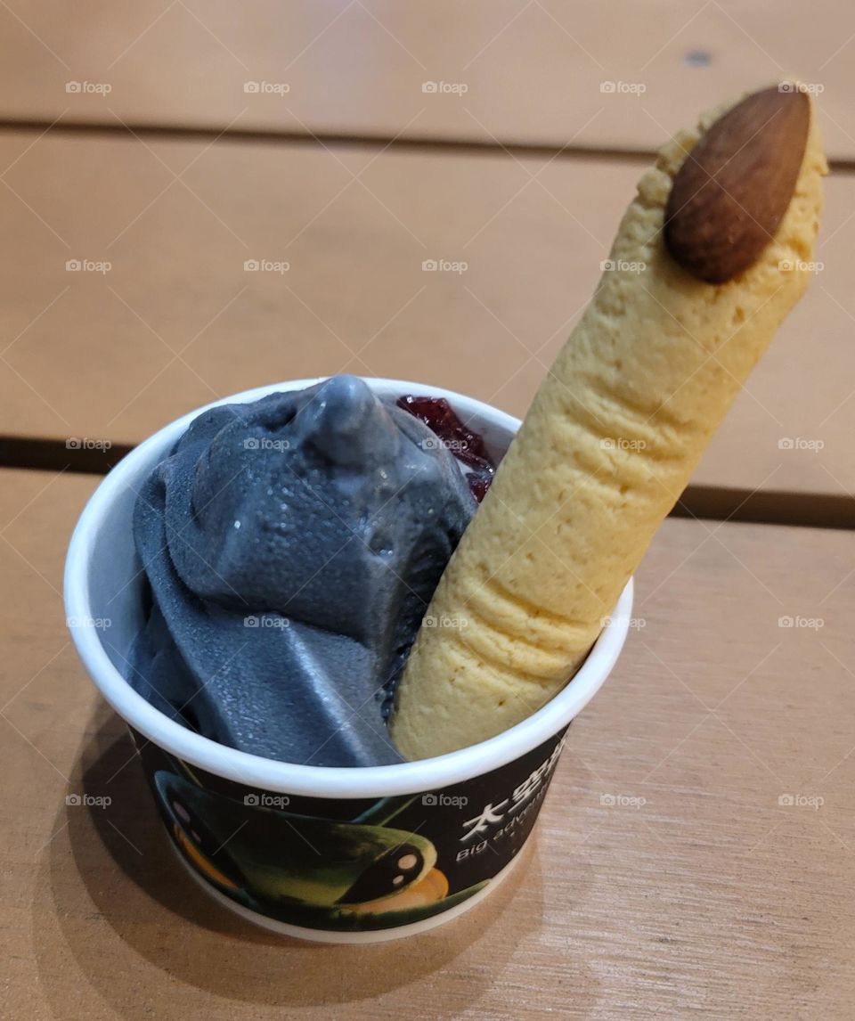 black ice cream with Witch finger biscuit