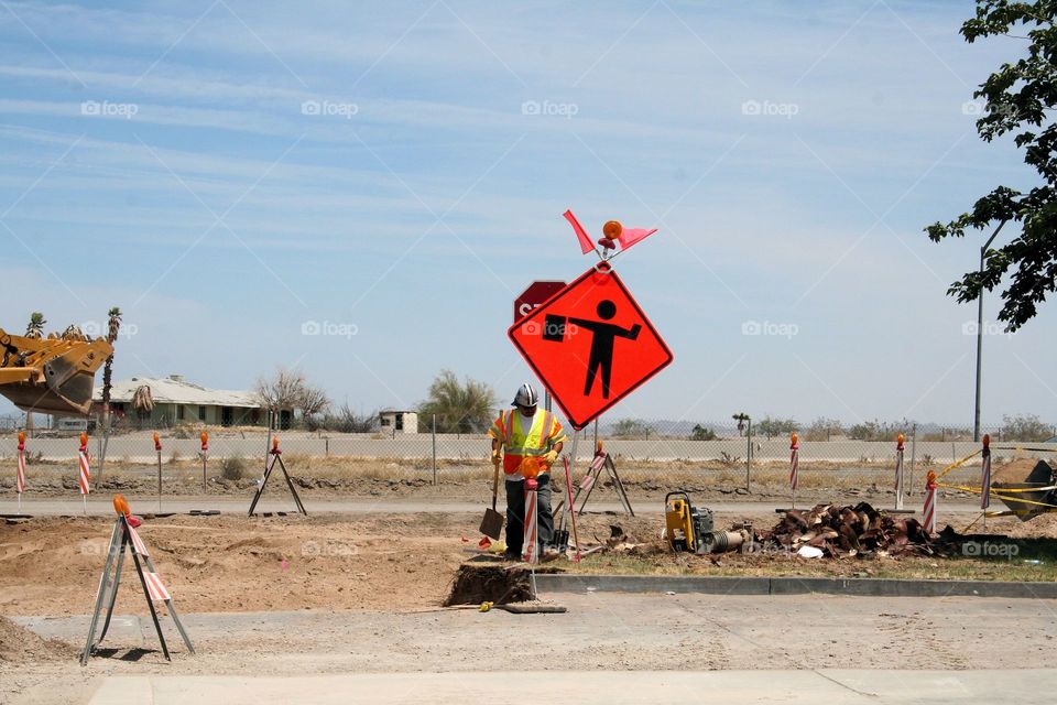 Flagman Ahead. Road construction workman.