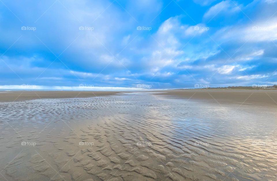 Low tide at the beach at dawn