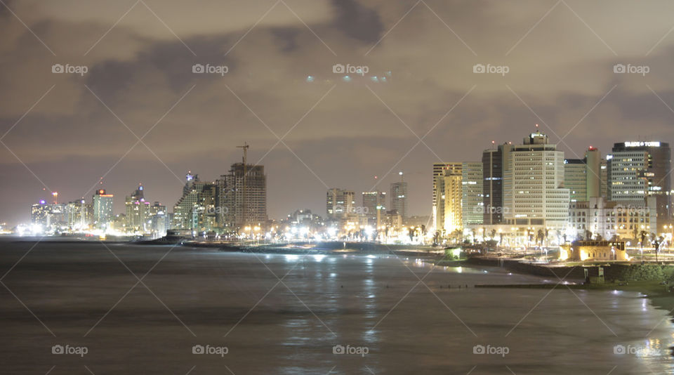 city buildings night sea by capoeira