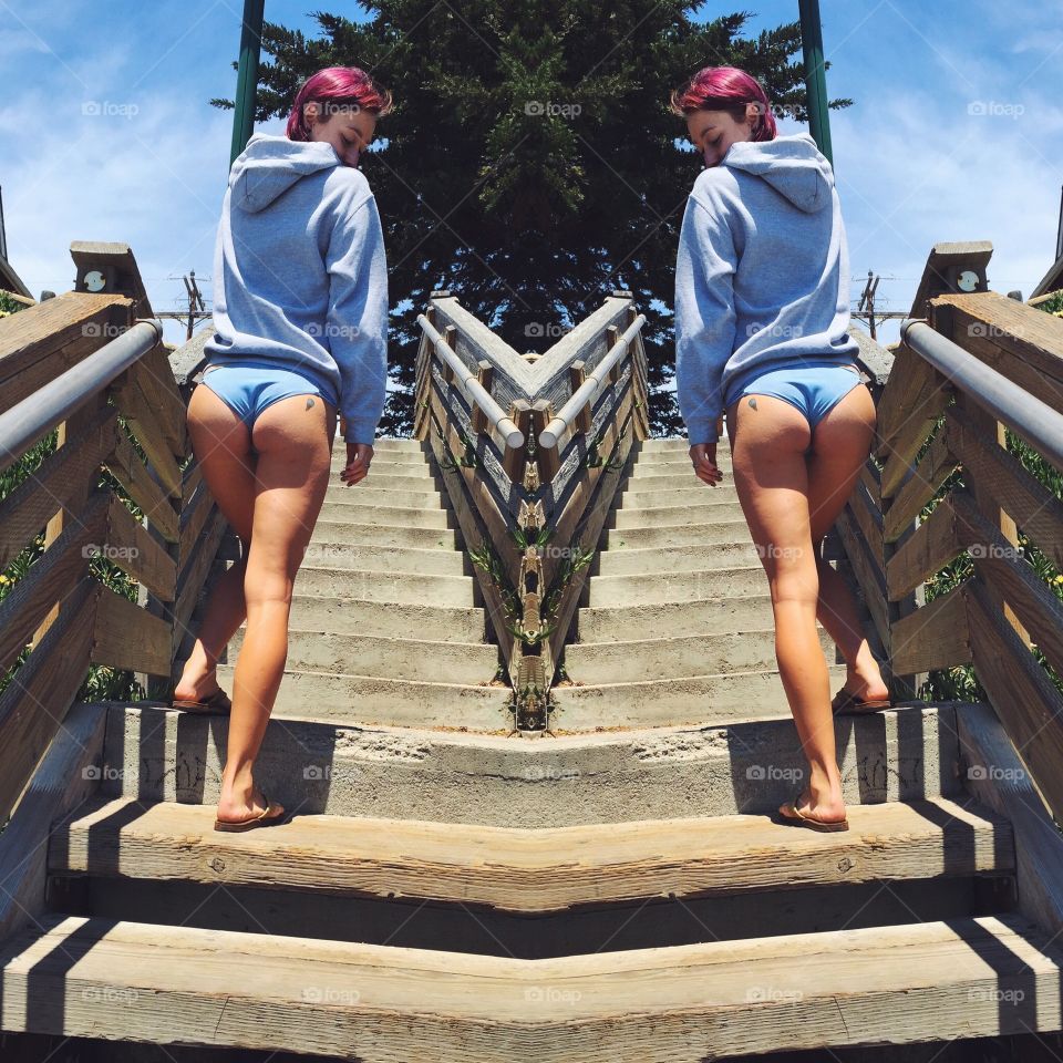 Rear view of woman walking on staircase