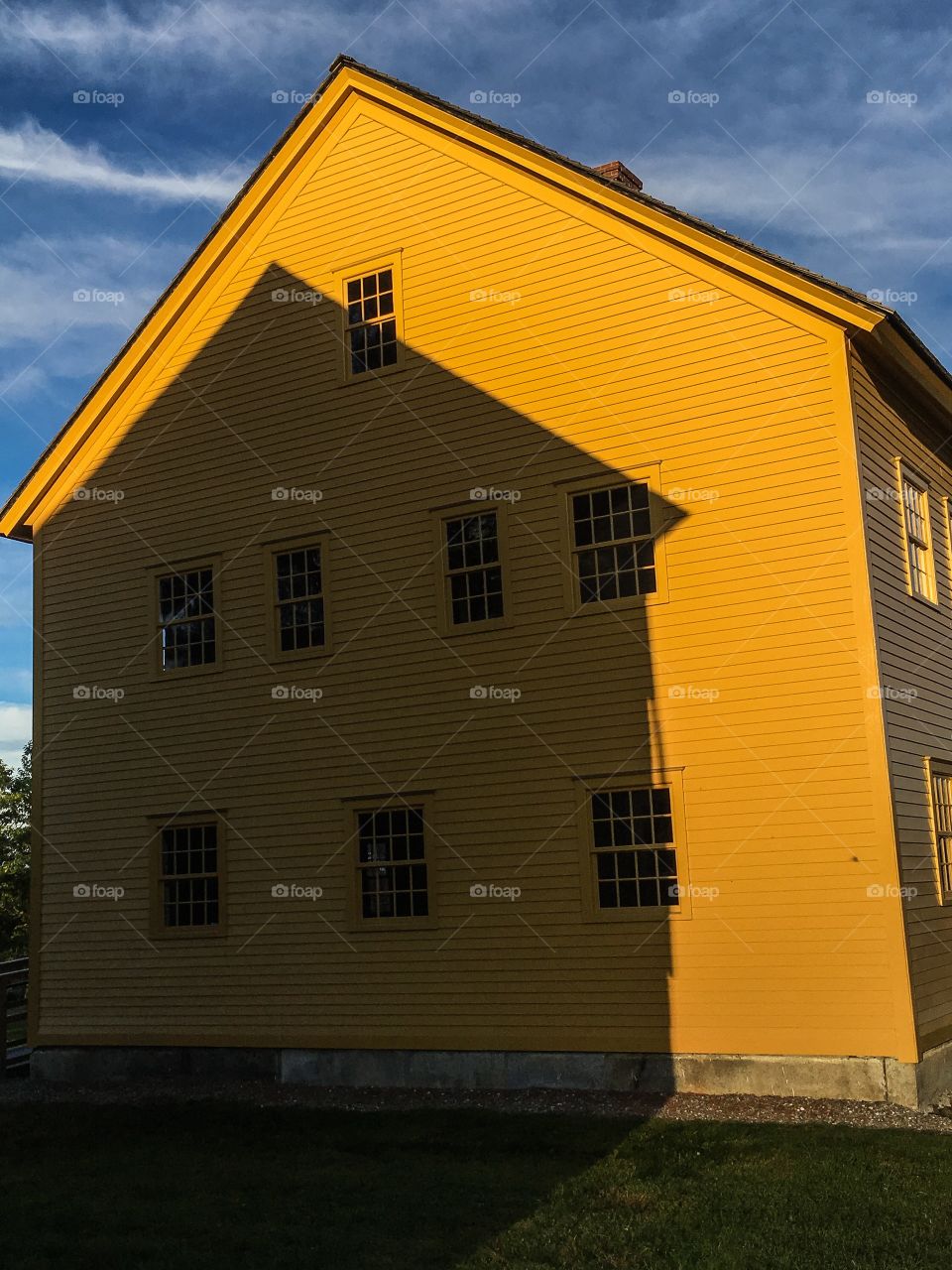 Always in its shadow...these two buildings were so in symmetry that the shadow matches up with the structure of the yellow building. 