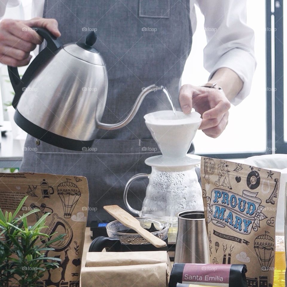 Barista. Pouring Coffee at BRATS cafe