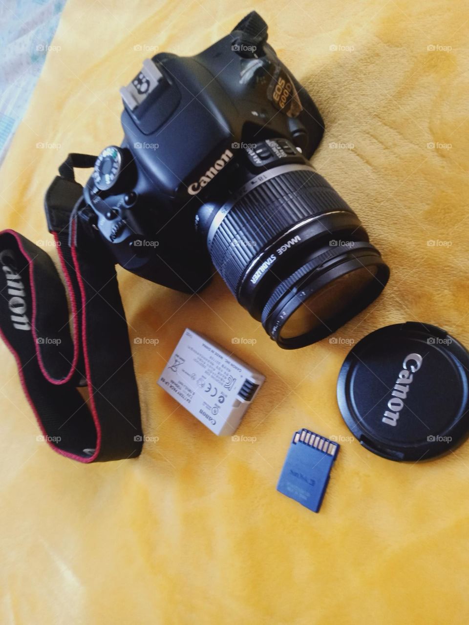 Camera in photography is a device for recording an image of an object on a light-sensitive surface, it is essentially a light-tight box with an aperture to admit light focused onto a sensitized film or plate.