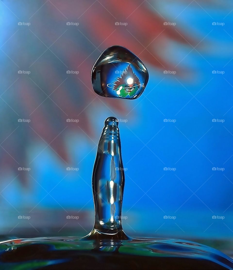 Waterdrop art with a reflection of an old Journey record