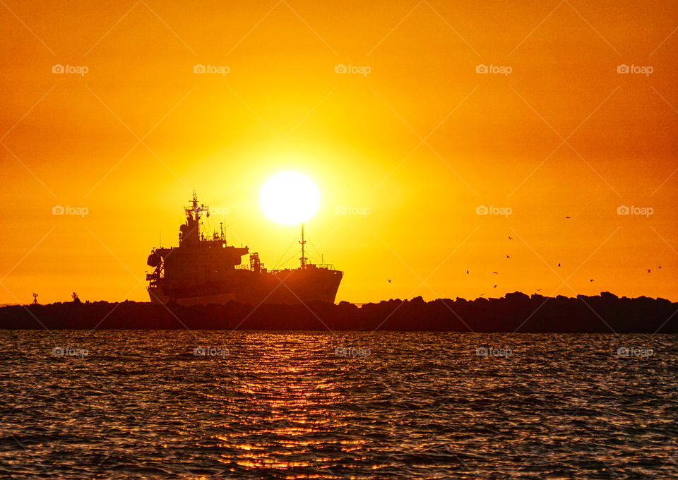 Silhouetted ship