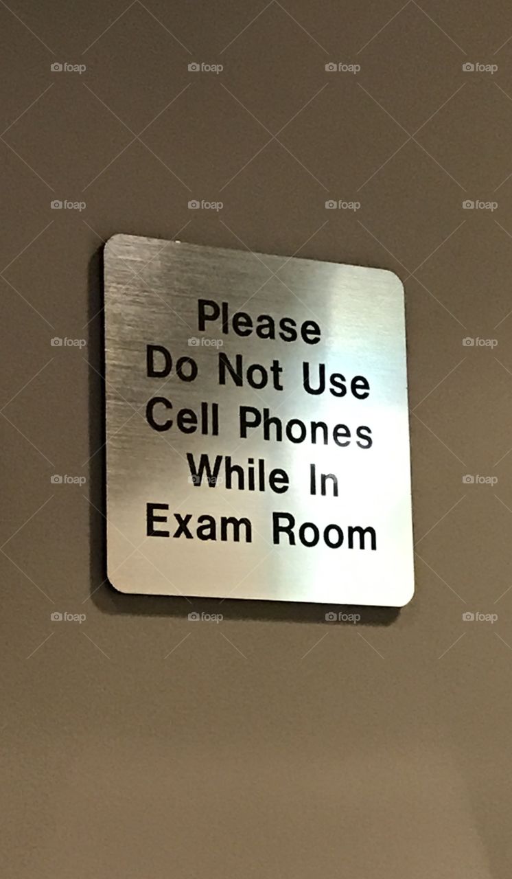 Cell phone usage sign in hospital. 