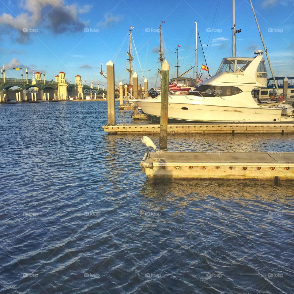 Bridge in the distance . A bridge behind a boat at the marina 